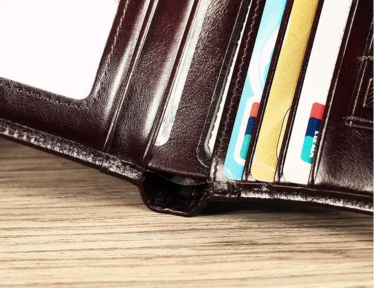 Men's black leather wallet showing multiple card slots, coin pocket, and document section