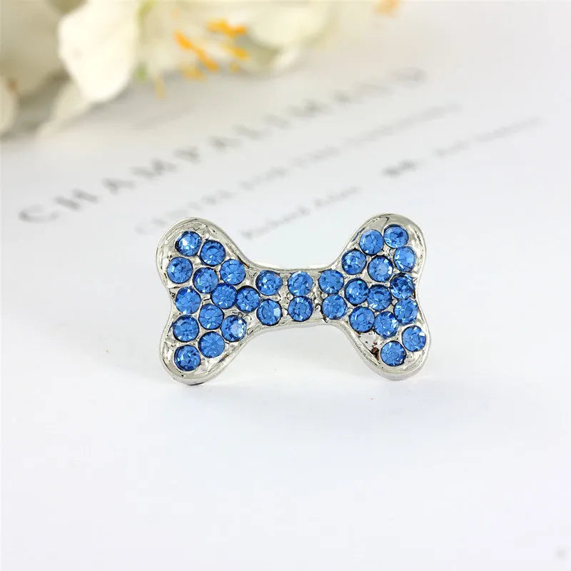 Rhinestone dog bone hair clip in alloy, shown in white, pink, blue, red and purple colour options.