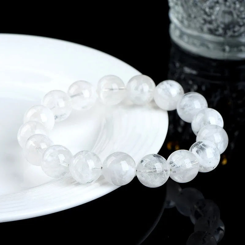 Women's crystal beaded bracelet with blizzard snowflake round beads and Ruyi Xiangyun design.