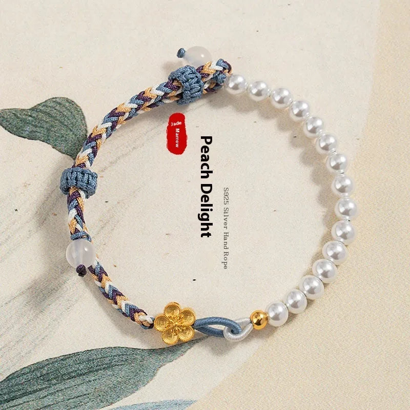 Peach-coloured cord bracelet with sterling silver Chinese flower weaving, chalcedony and pearl details.