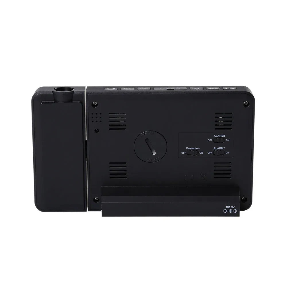 Multifunctional projection alarm clock showing time and temperature, with outdoor sensor and adapter.