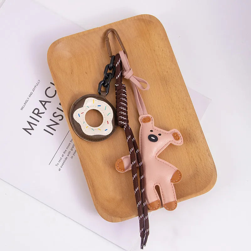 PU leather bear bag charm keychain with donut design in brown, pink, black, white, or rose red.