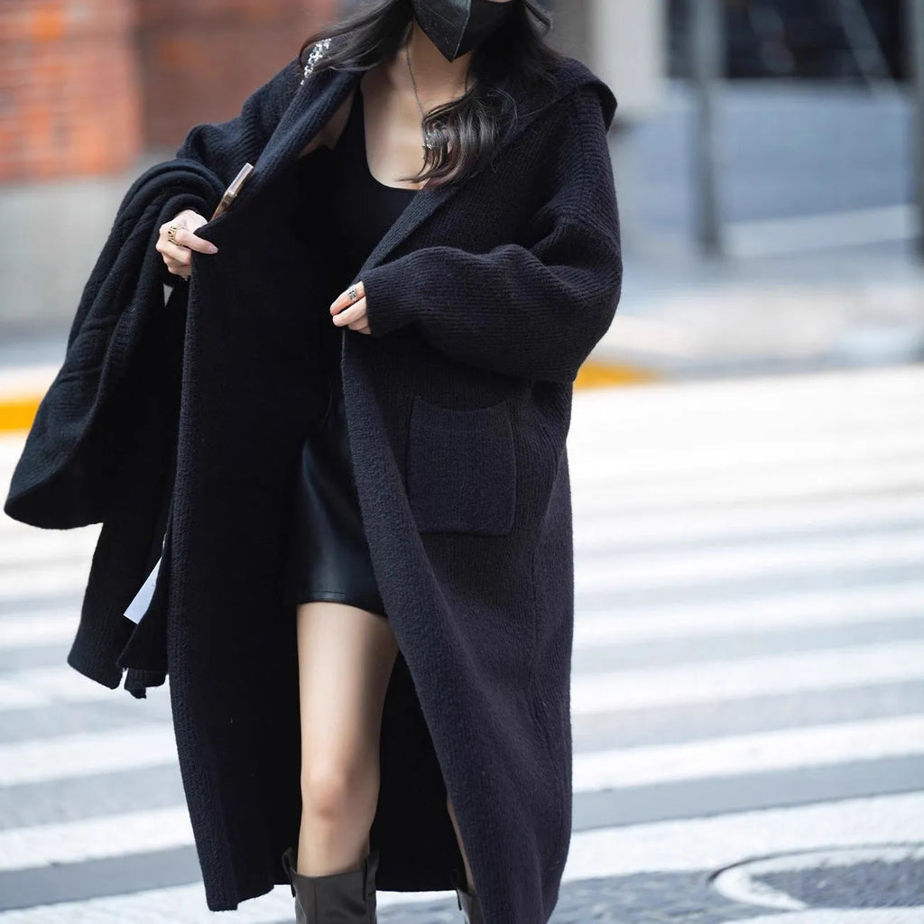 Long grey knitted hooded trench coat cardigan showing cardigan styling and length