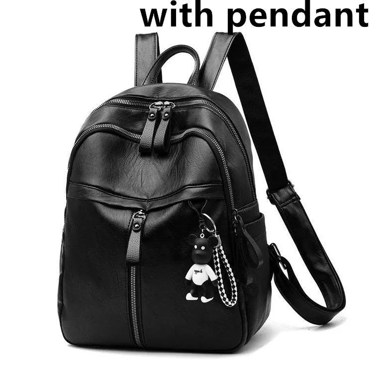 Medium black PU leather backpack with double straps showing internal organisation and waterproof features