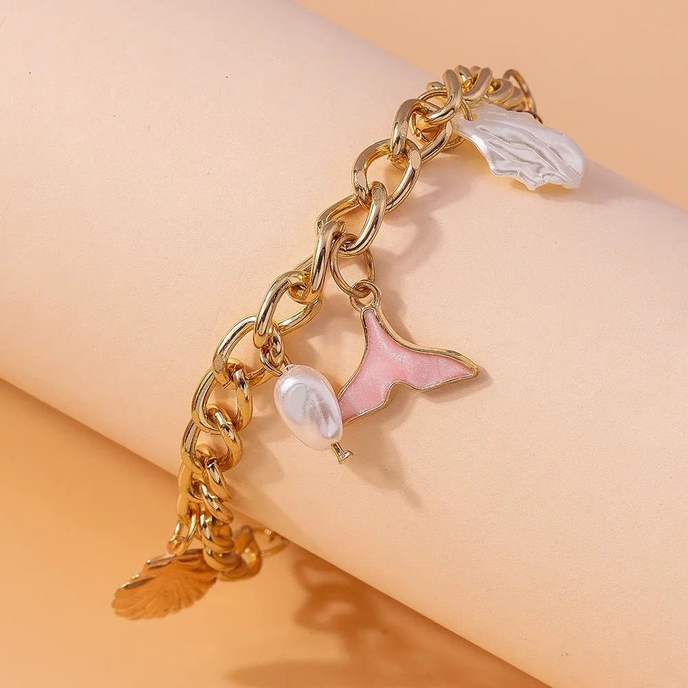 Women's shell pearl mermaid tail bracelet in white pearl alloy finish
