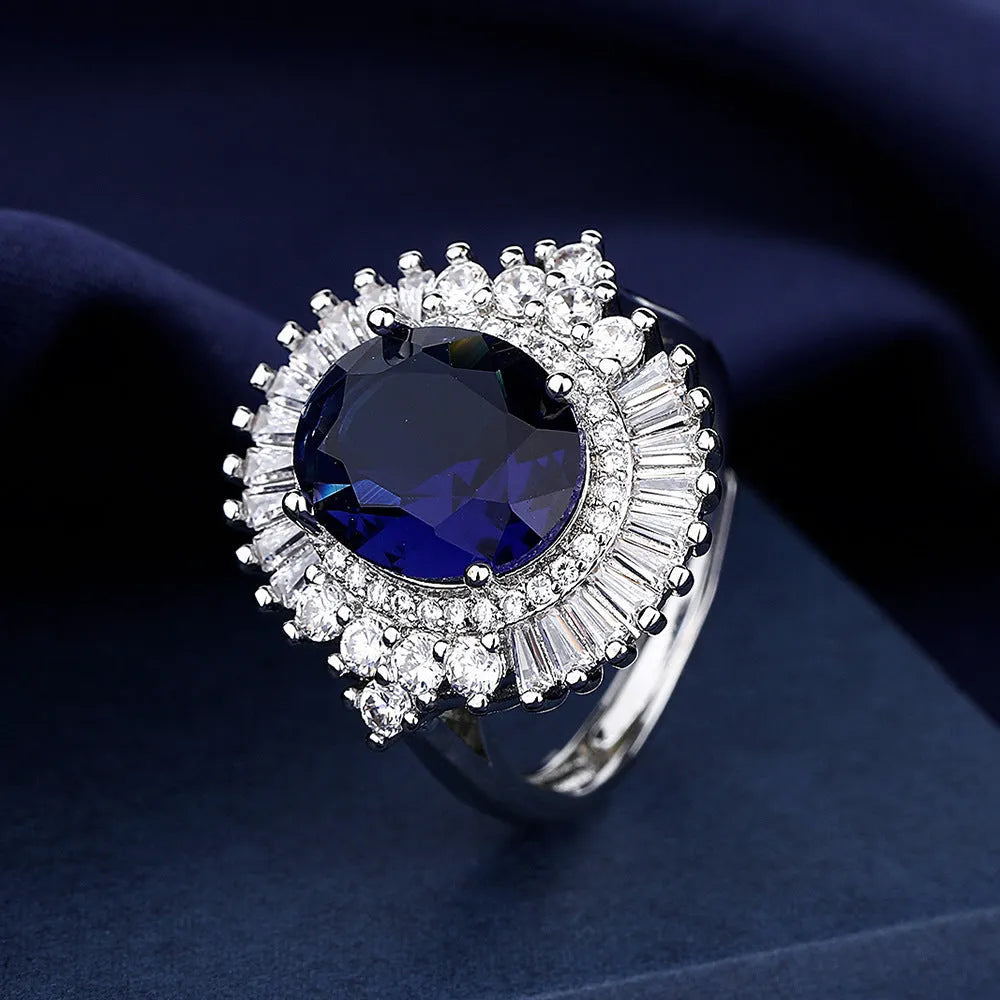 White gold colour copper crown shape ring with sea blue heart centrepiece and open mouth adjustable design