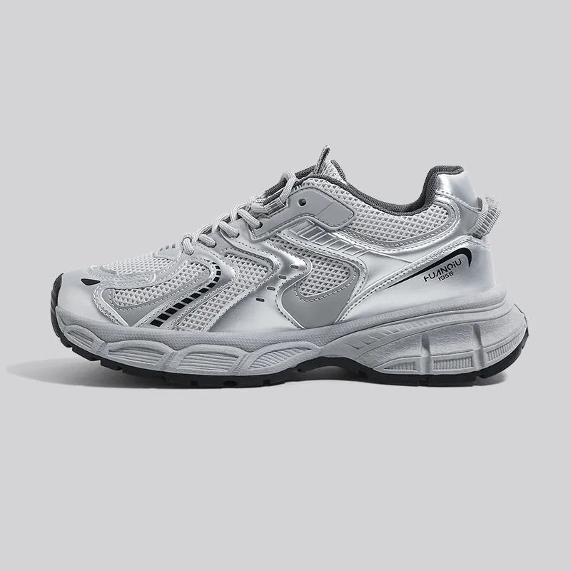 Men's grey low-top platform sneakers with leather stitching on a PU mesh upper and a flat EVA sole.