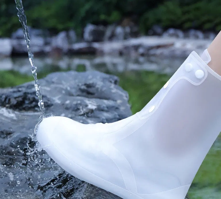 White high-top PVC reusable shoe covers for women with anti-skid sole.