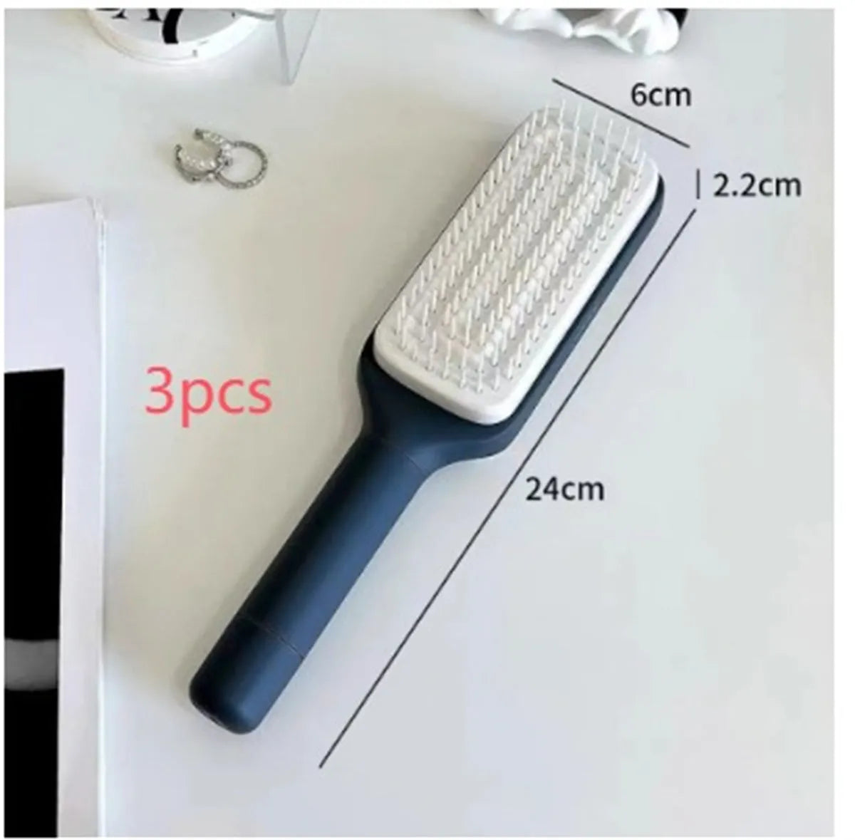 Roland purple self-cleaning hair brush with anti-static massage comb on a white background.