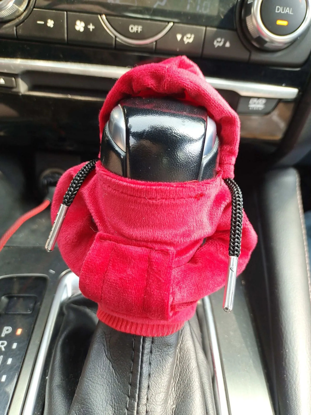 Pure cotton car gear lever decoration in red, shown on a gear stick.