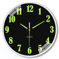 8 inch luminous wall clock with modern white plastic shell on a wall.