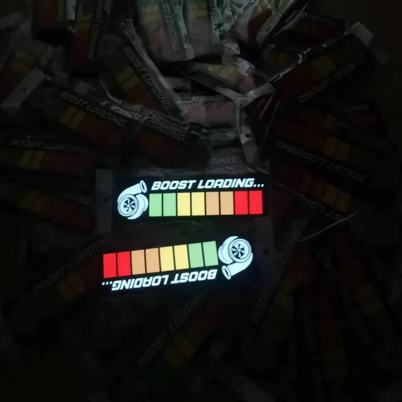 Electroluminescent car window sticker glowing white on a 0.5mm thick panel.