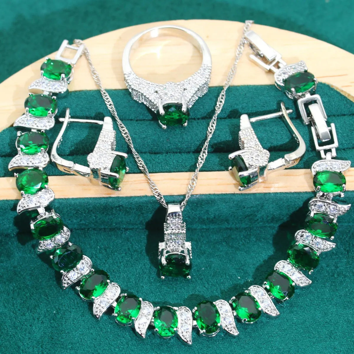 Four-piece bridal jewellery set with zircon alloy necklace, earrings, bracelet, and ring in water wave chain design