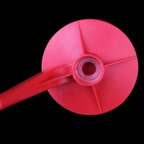Red plastic Magic Tap soda dispenser for 2-litre bottles, 15 cm high, 10 cm diameter, with push-in tap.