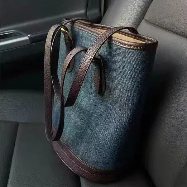 Denim patchwork polyester bucket handbag showing structured shape and one-shoulder strap