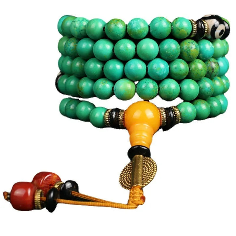 Natural turquoise beaded bracelet with 108 polished 8mm round beads on a wrist.