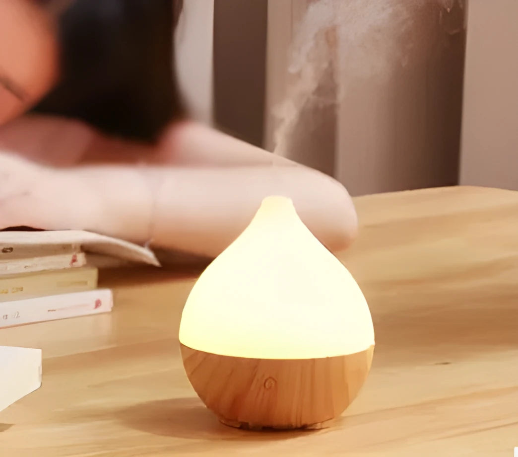 Asakusa wood grain vase-shaped aroma diffuser with USB cable on a wooden surface.