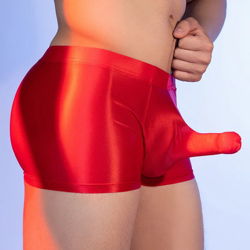 Men's seamless nylon boxer shorts in an animal print, shown in red, featuring a mid-waist design.