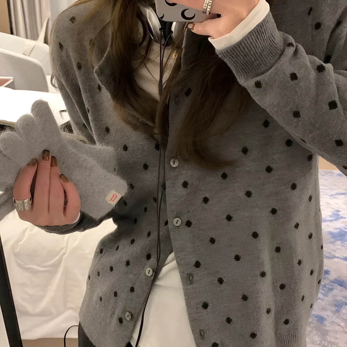 Women's grey dot knitted cardigan with crocheted flower detailing and long sleeves