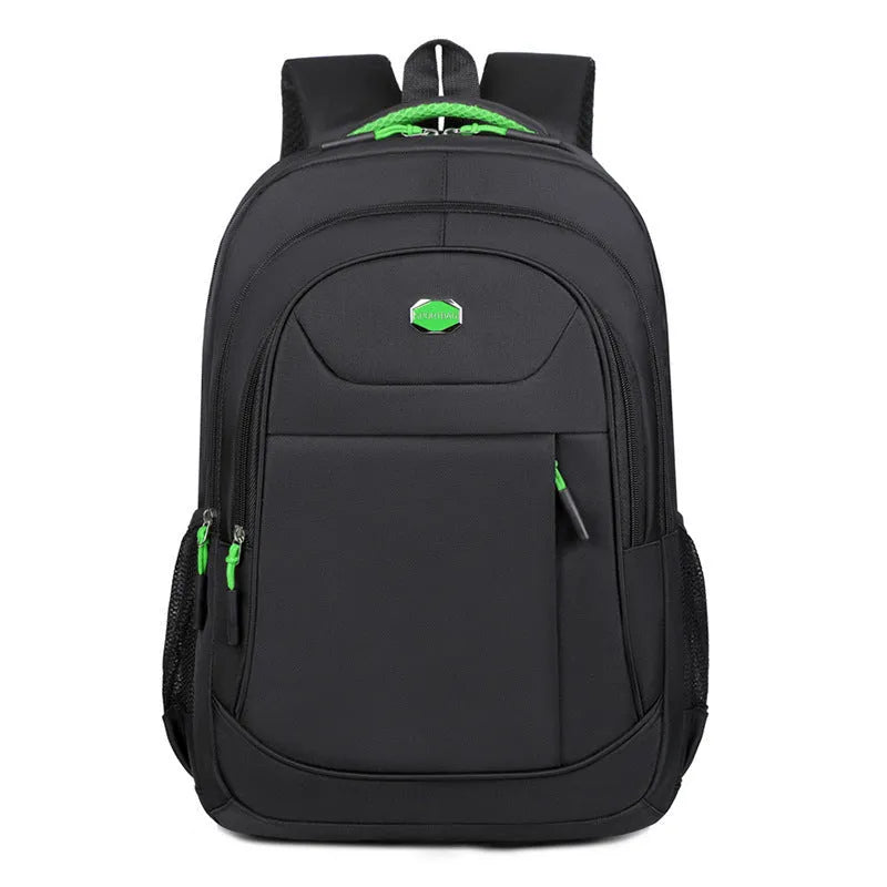 Solid colour Oxford cloth student backpack with curved shoulder straps and multiple storage compartments.