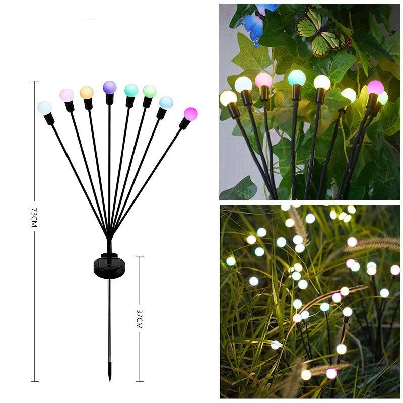 Solar-powered LED garden lamp with multiple light heads and ground plug stakes on a lawn
