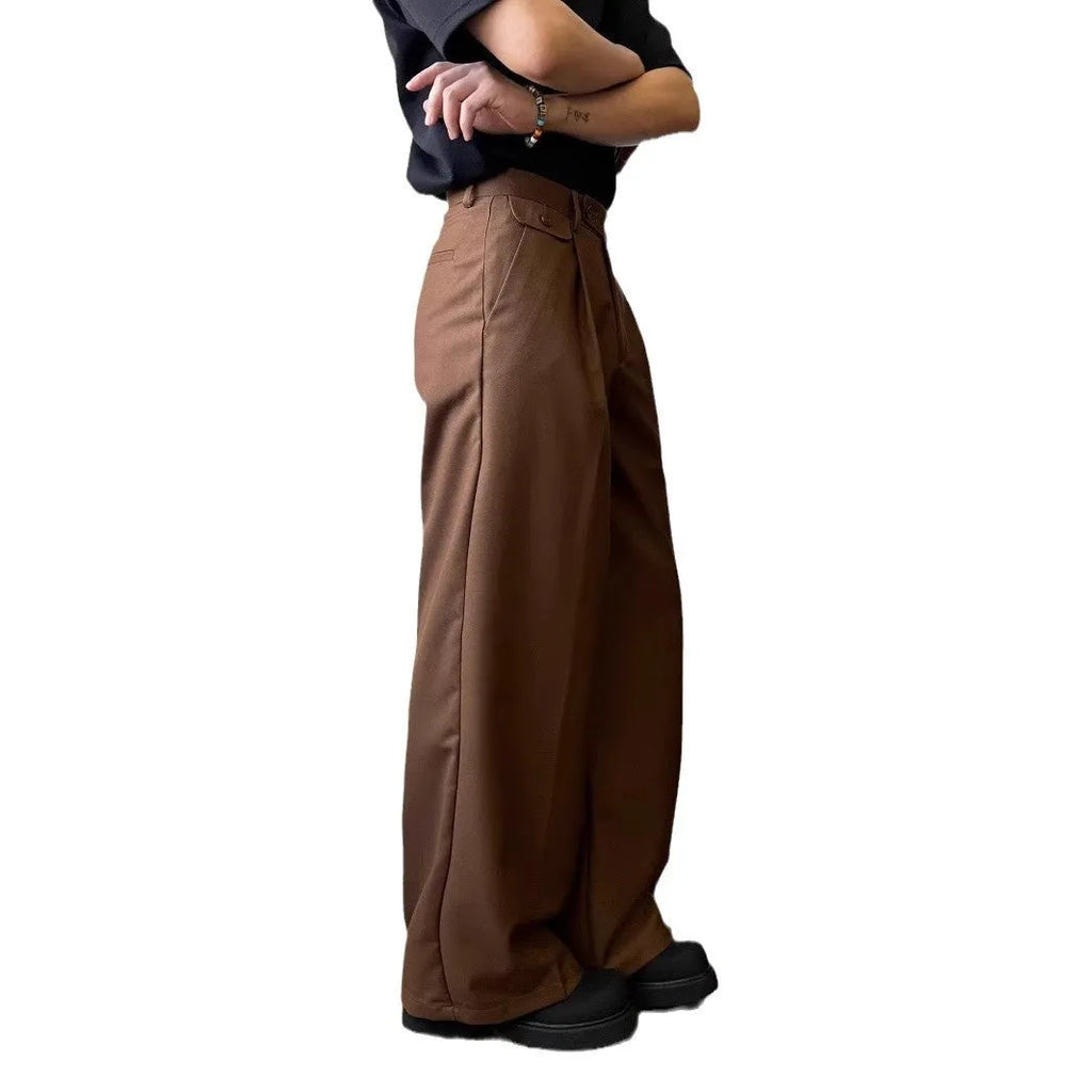Men's brown straight-leg casual trousers with a loose, wide-leg fit on a neutral background.