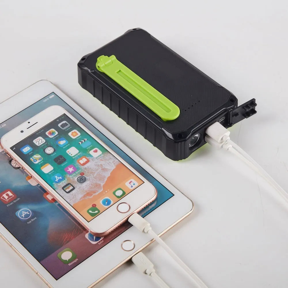 Orange and green hand solar mobile power bank with hand crank and dual USB ports