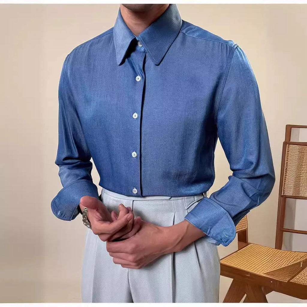 Men's slim fit long sleeve round collar shirt in a light blue colour, showcasing the button front and cuff detail.