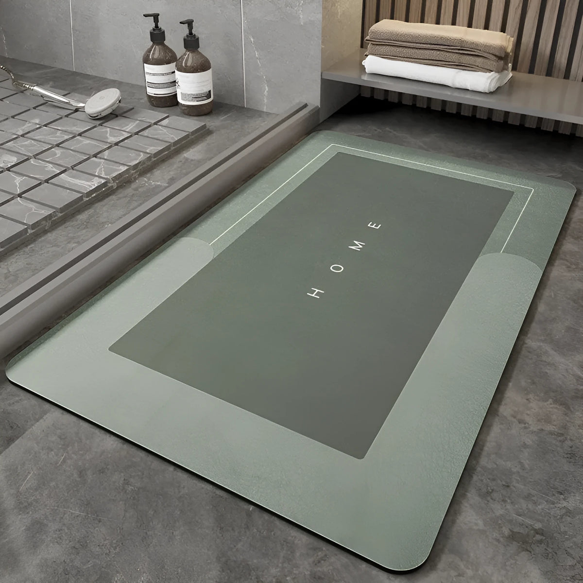 Blended fibre machine woven bathroom floor mat in blue, shown in an oval shape on a tiled floor.