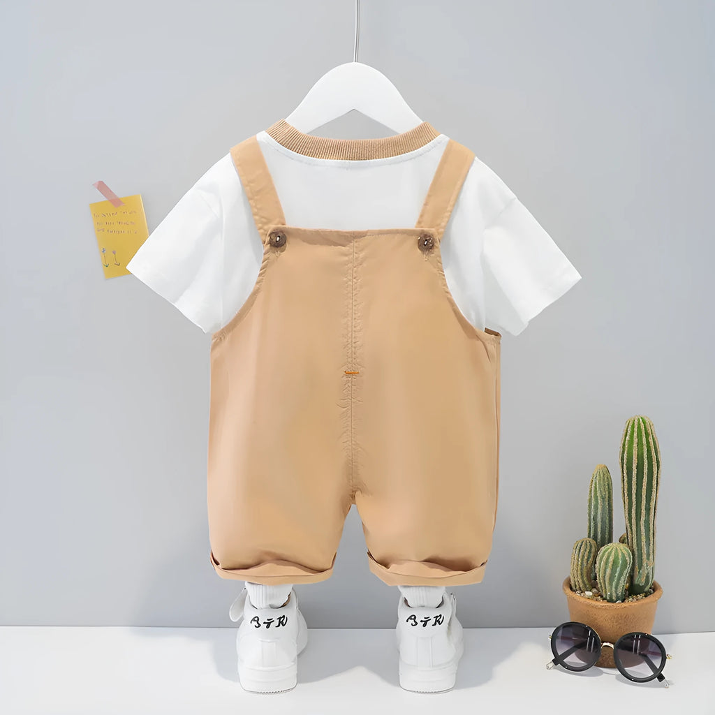 Yellow cotton baby overalls with cartoon print, short sleeves, and adjustable straps on a hanger.