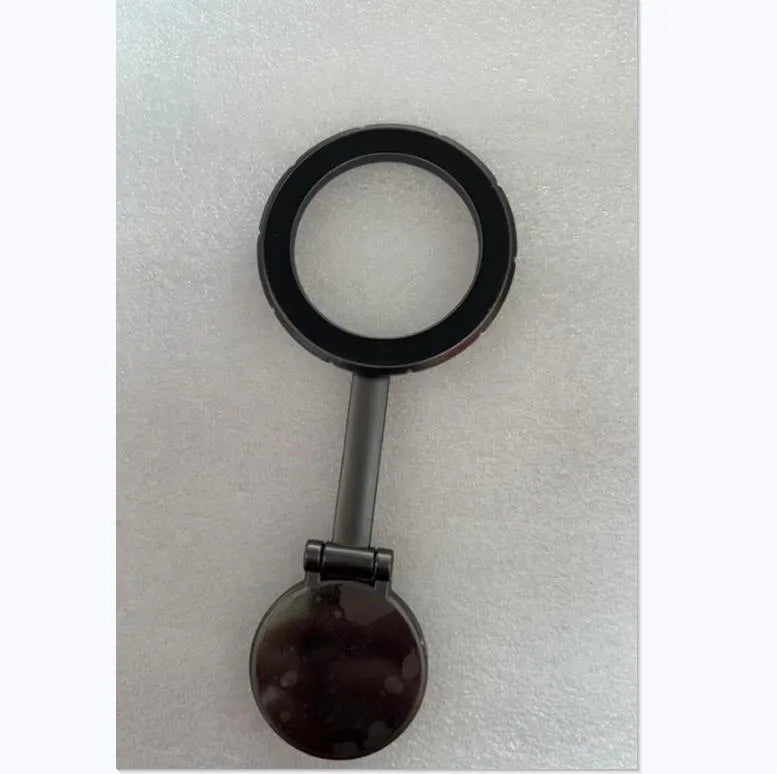 Foldable all-metal magnetic car phone mount in Qian colour on a car dashboard.
