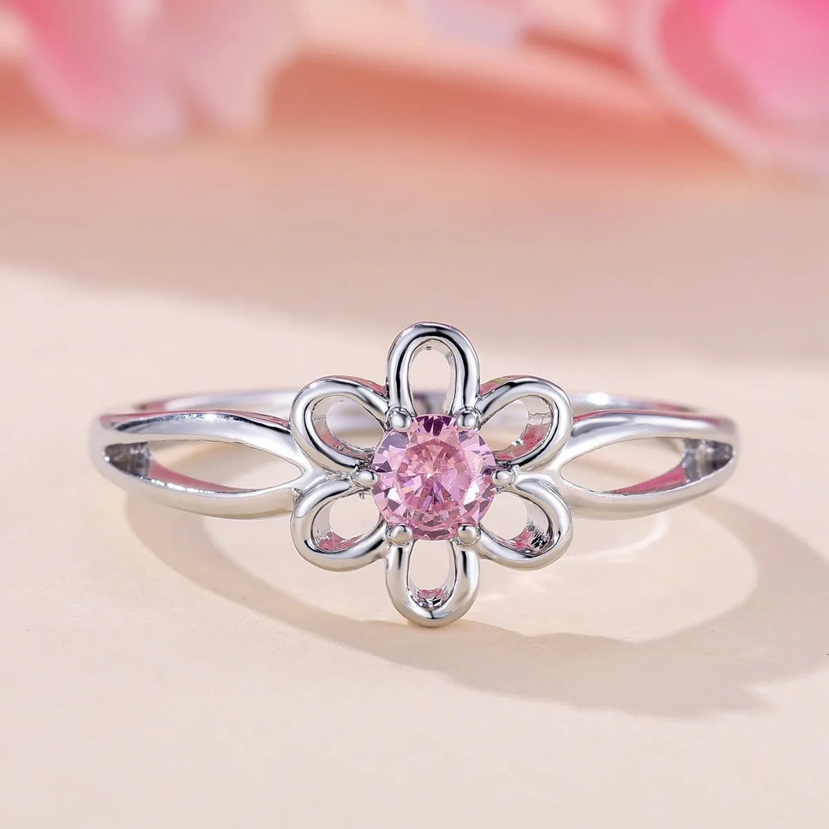Women's electroplated copper ring with floral hollowed design in platinum pink diamond colour