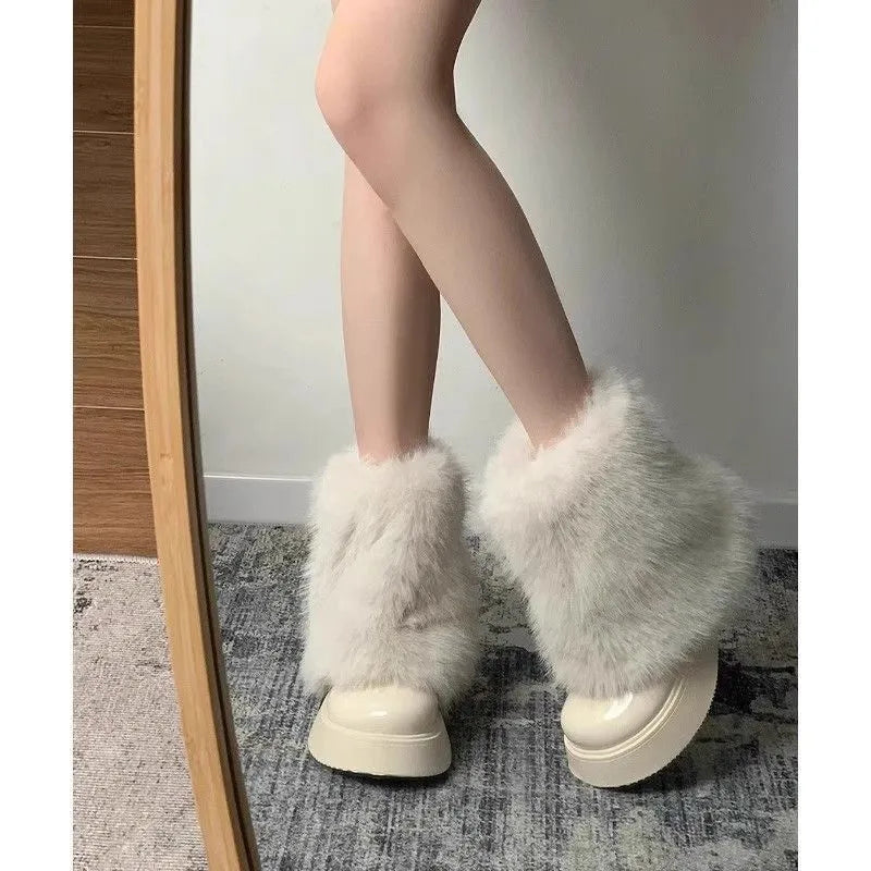 Women's black artificial plush snow boots with waterproof platform sole and low top design.