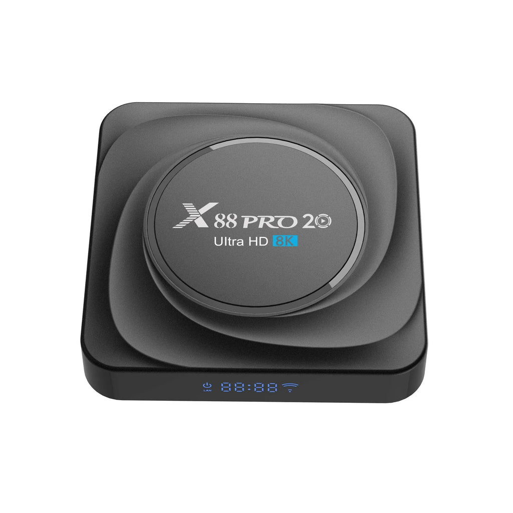 Compact black Android TV box with HDMI port, shown with remote control and power cable