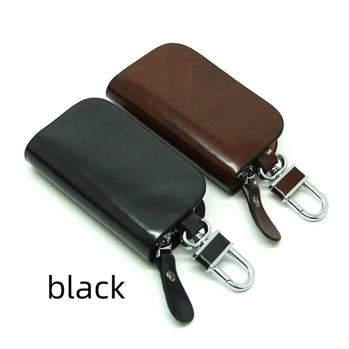 Genuine leather car key case in black or brown with frosted finish and 9.5cm by 4.5cm internal dimensions