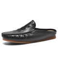 Men's black breathable Gommino semi-slippers with a rubber sole on a plain background