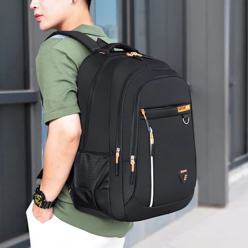 Men's large Oxford cloth schoolbag in red with letter pattern and burden reduction straps.