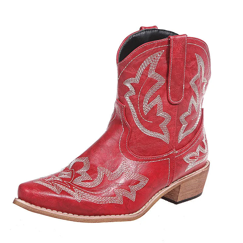 Women's brown cowboy boots with embroidery on the shaft, pointed toe, and a low wedge heel.