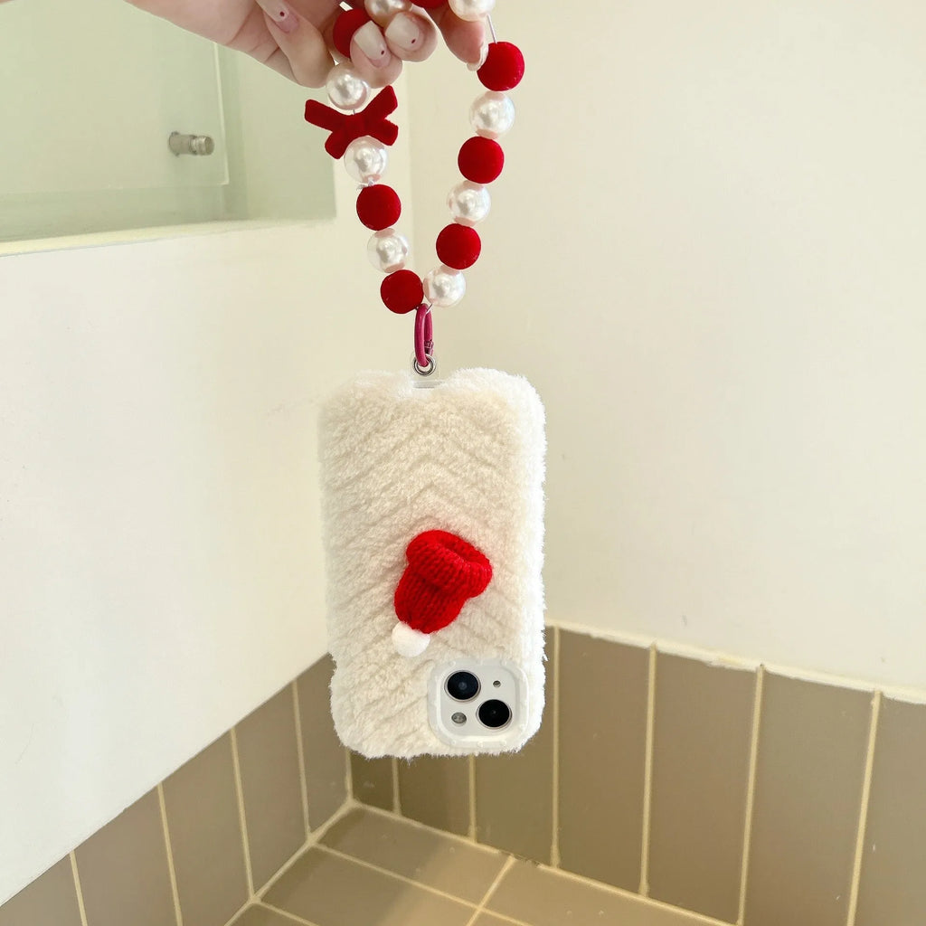 Red Christmas hat iPhone case with plush bracelet for iPhone 14, 13, 12 and 11 models, silicone back cover.
