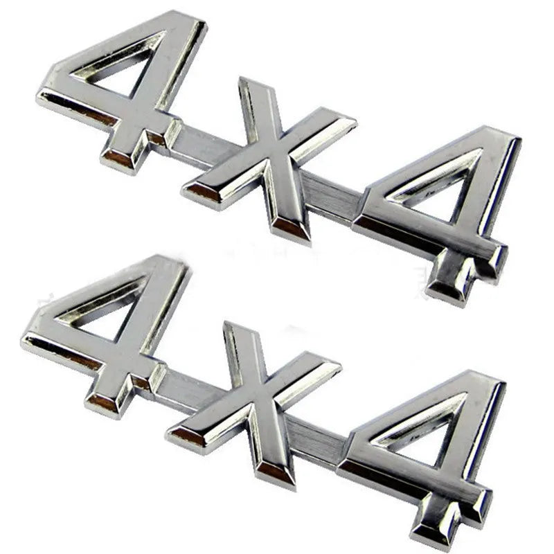 Metal 4x4 rear car badge in silver plated or black, 9cm x 3.5cm, for off-road vehicle use.