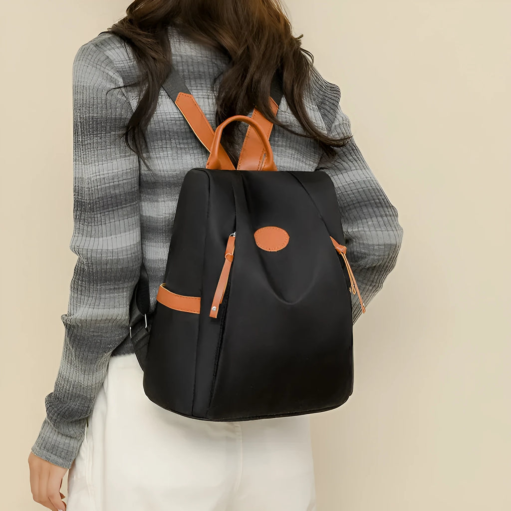 Waterproof Oxford cloth anti-theft travel backpack in black with sandwich pocket and zipper compartments