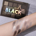 15-colour eyeshadow palette showing earth tones including cos grey, black, and dark colours for smoky makeup