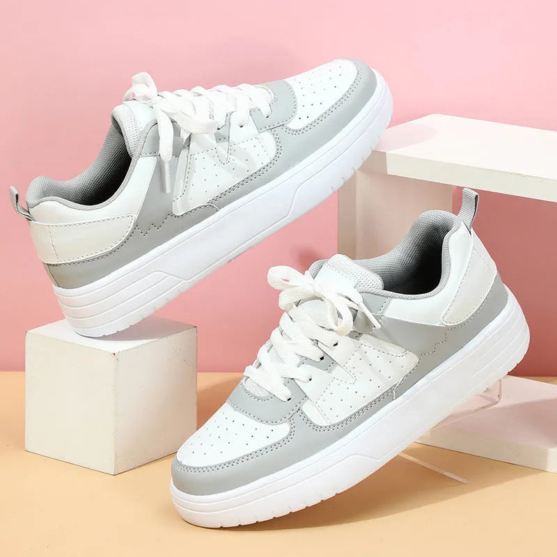 Couple platform sneakers with white upper, round toe, and EVA sole with lace-up closure.