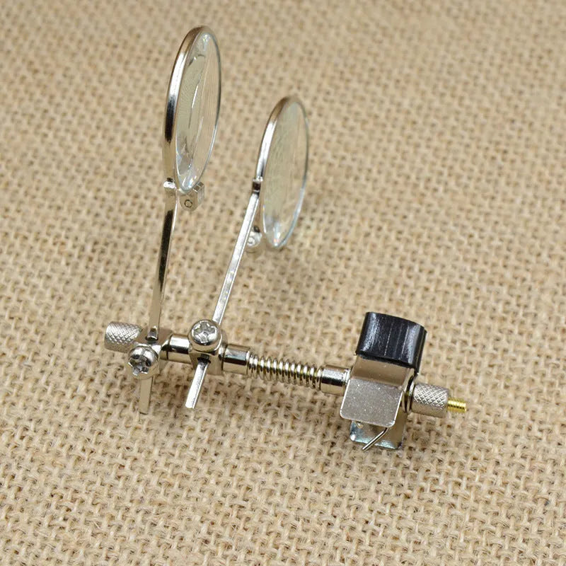 Metal frame auxiliary reading glasses with a double clip design for attaching over existing eyewear.