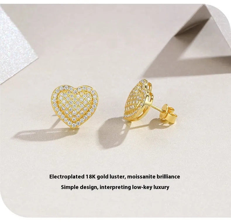 Golden heart-shaped moissanite stud earrings on a 925 sterling silver post.