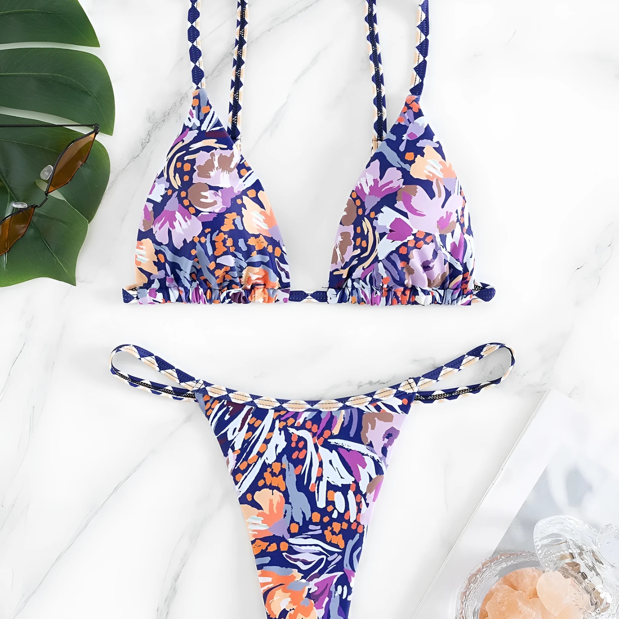 Women's floral print triangle top bikini with briefs bottom on a mannequin