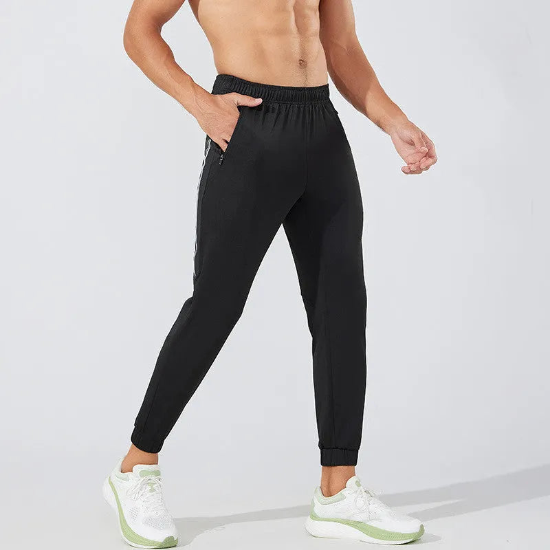 Men's black polyester sports trousers with mid waist design for running and exercise