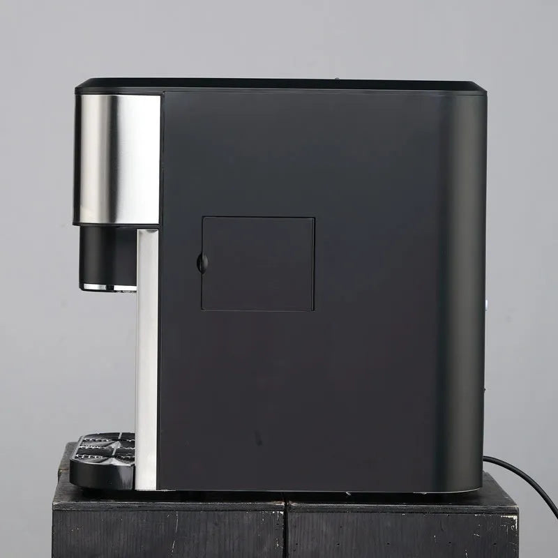 Black desktop ice maker with ice crushing and cold water functions on countertop