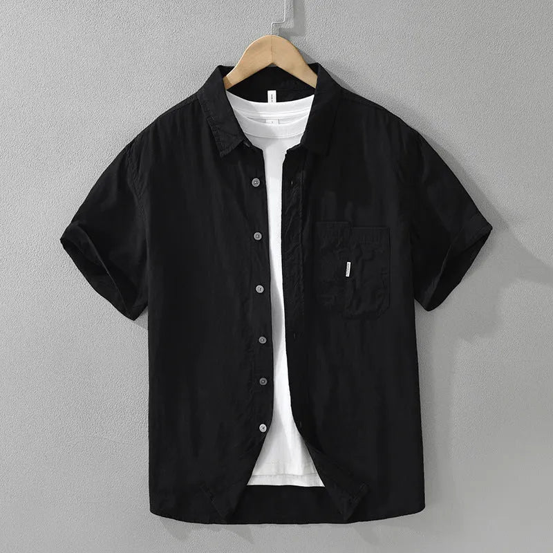 Women's loose-fitting lyocell cardigan-style top in black, shown on a model.
