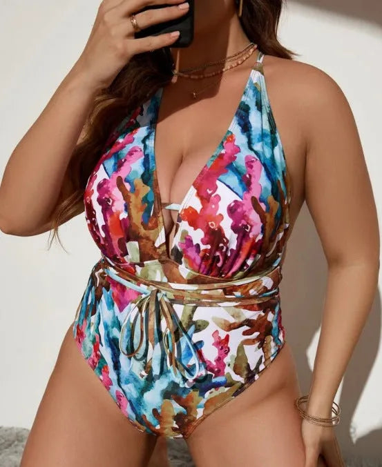 Solid purple halter swimsuit on a mannequin, showing the one-piece bikini briefs style.